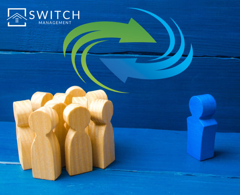 Wooden figures in a circle with a blue wooden figure outside of the circle, swirling arrows in a circle and a blue background