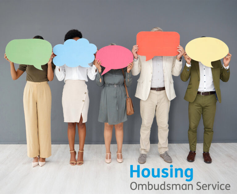 People holding bubble cards and Housing Ombudsman