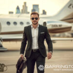 A businessman with a plane in the background