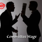Two men figures clashing with a dark grey background and Committee stage and Passed wording
