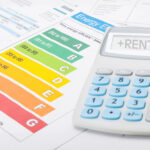 Calculator saying rent and EPC report on a desk with bills