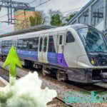 Elizabeth Line train and green arrow pointing updates from smoke