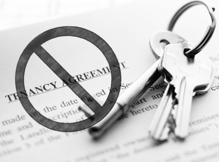 Keys and a stop notice over a tenancy agreement