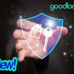 A hand holding a shield with a key and a house, the logo Goodlord and a black background