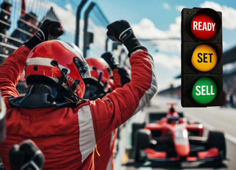 A pit stop, traffic lights saying ready, set, sell and a person in a racing outfit