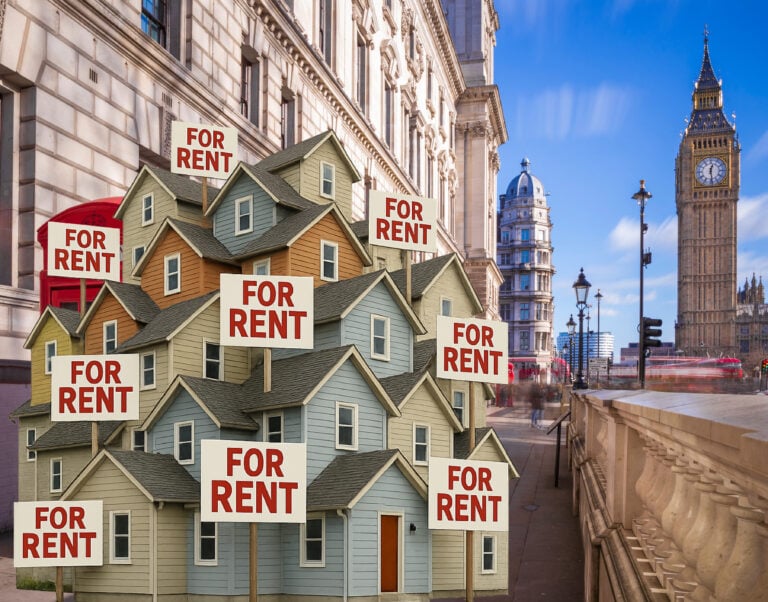 Houses with sold signs with a background of Big Ben, The Thames, and London buildings