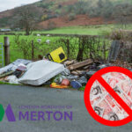 Rubbish left on a country lane, fields in the background and UK notes inside a red warning sign