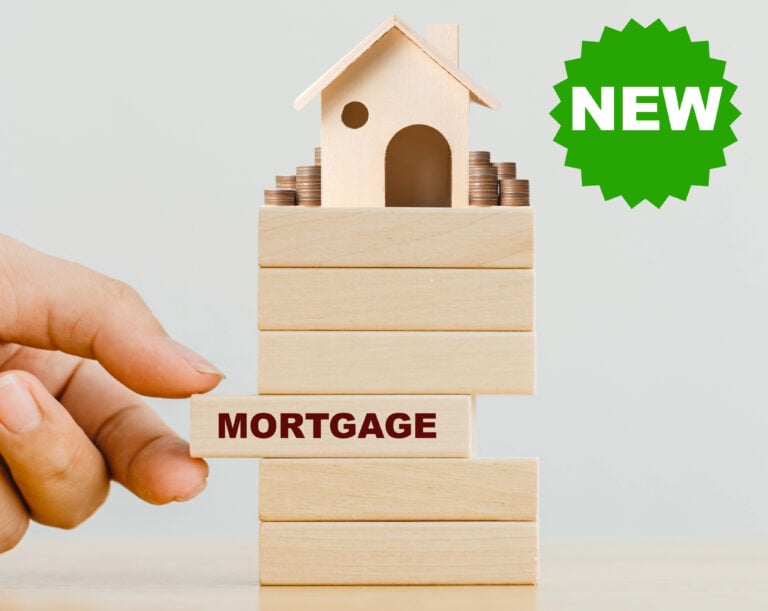 Wooden house on sliding blocks and text Mortgage and New