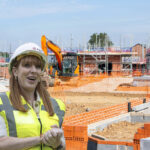 Deputy Prime Minister and Housing Secretary, Angela Rayner, a house being built in the background