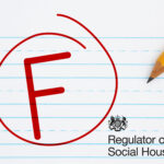 The letter F in a red circle, a pen and REgulator of Social Housing logo on a stripped writing paper background