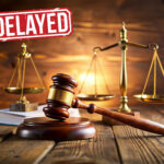Judge’s gavel and scales of justice symbolizing court delays in landlord possession cases