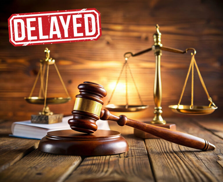 Judge’s gavel and scales of justice symbolizing court delays in landlord possession cases
