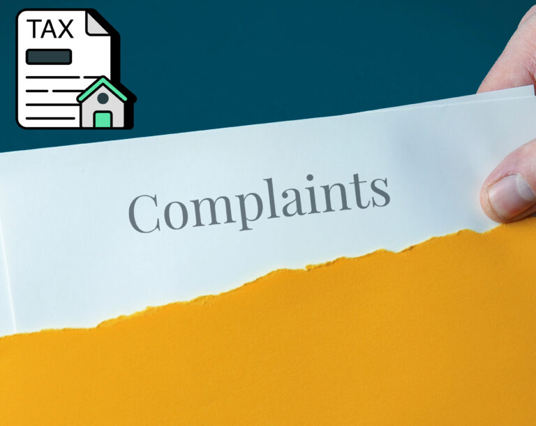 An envelope with a complaints paper and a graphic with a tax document and house