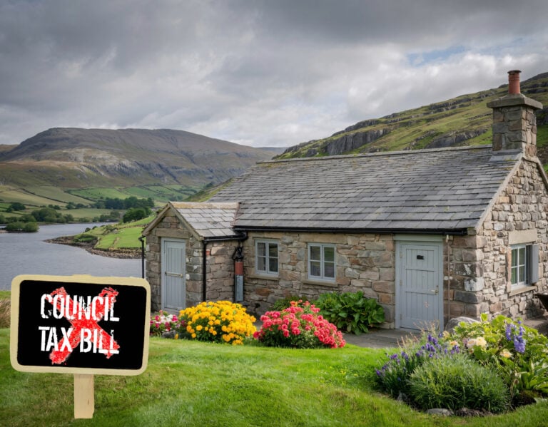 Cottage with backdrop of mountains and lake, and a Council tax bill sign