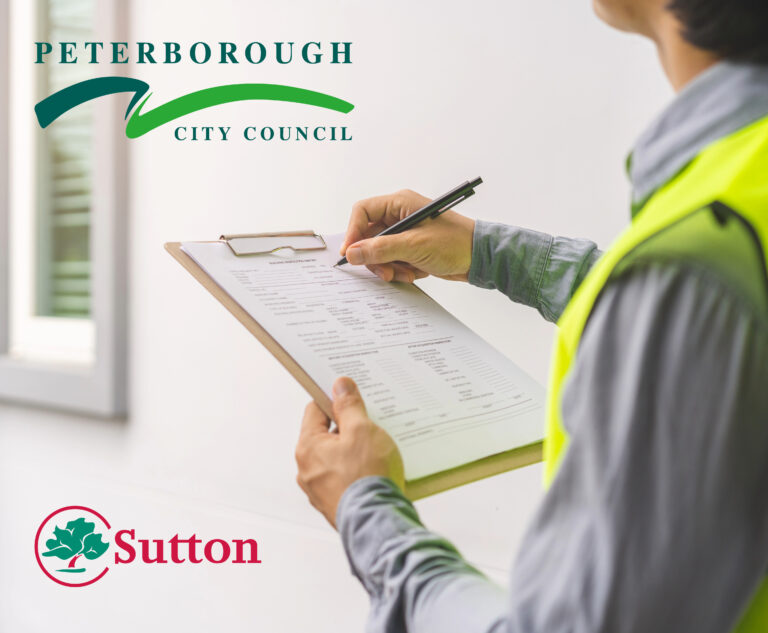 Someone checking off items on a clipboard for selective licensing near a house with the peterborough city counil and Sutton council logos