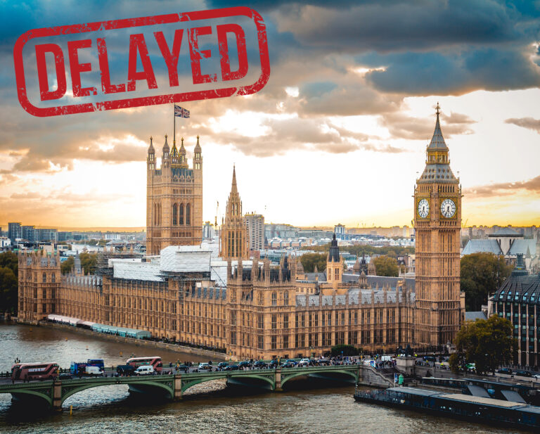 Houses of parliament with a delayed sticker
