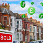 Terraced houses with a sold sign and flying pound signs