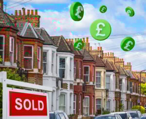 Terraced houses with a sold sign and flying pound signs