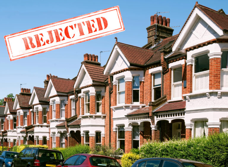 Row of houses with the text Rejected
