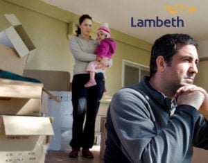 Family looking sad with boxes in a room