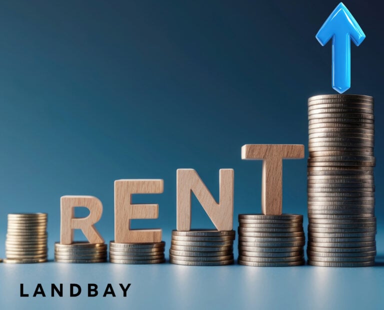 Coins stacked with a blue arrow pointing upwards and the words RENT balanced on top of the coins