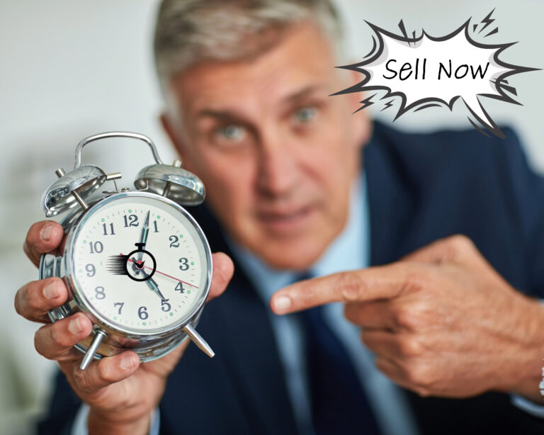 Man in background pointing to a clock with sell now in text
