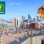 Houses with london in the distance with a house stuck to a soaring rocket in the sky