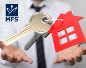 A man in a shirt and tie with Keys on a keyring of a red house in his open hands