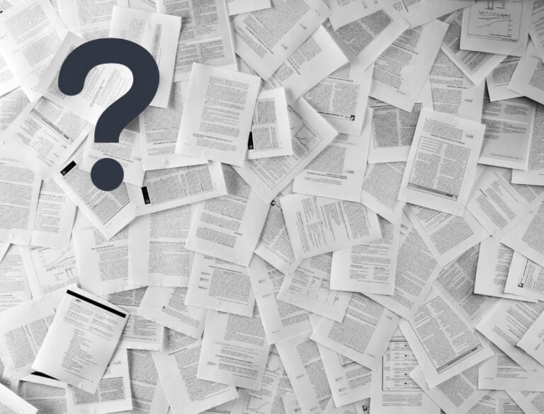 A black question mark over invoices