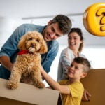 fanily with moving in boxes and a dog with a question mark