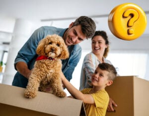 fanily with moving in boxes and a dog with a question mark