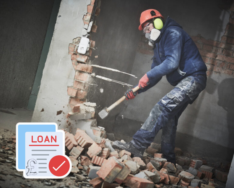Person knocking down a wall with a sledgehammer and loan paperwork