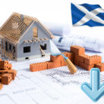 Model house under construction with Scottish flag and blueprints representing decline in Scotland’s BTR sector