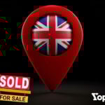 Pin location with the Uk flag inside with a house sold for sale house sign