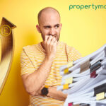 Concerned man on a yellow background with a gold pound sign arrow and legislation documents