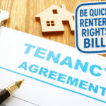 A desk showing a tenancy agreement, keys, a house and the text be quick Renters Right Bill