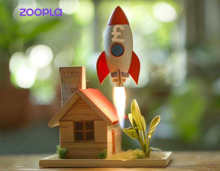 Image of a rocket soaring up above a model house
