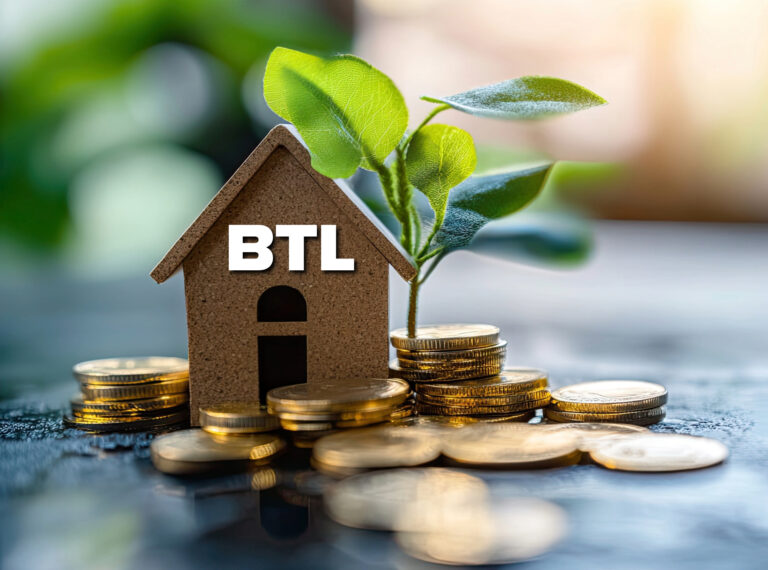 Miniature house labeled BTL surrounded by coin stacks and a growing plant symbolizing buy to let investment growth