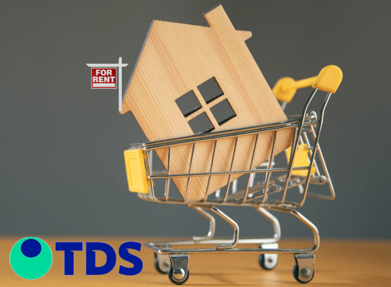 wooden house in a shopping trolley with a to rent sign on the house