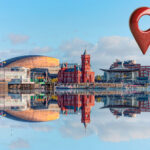 Cardiff Bay skyline with modern and historic buildings reflected on the water
