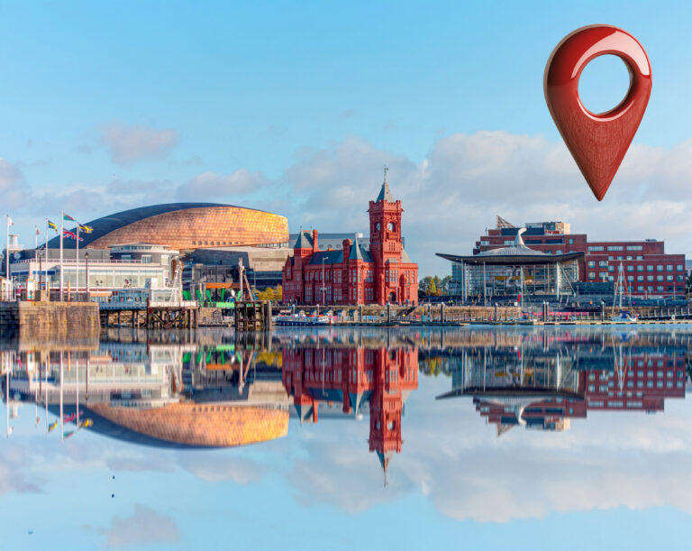 Cardiff Bay skyline with modern and historic buildings reflected on the water