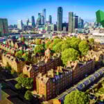 Houses with london in the background and an up arrow