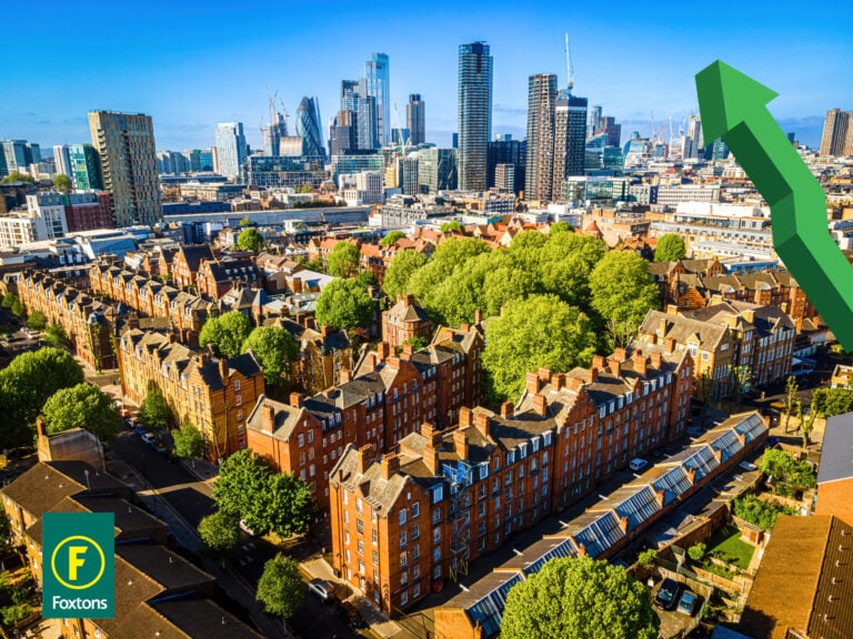 Houses with london in the background and an up arrow