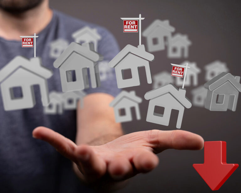 Houses and a down arrow on a mans hand with to rent signs