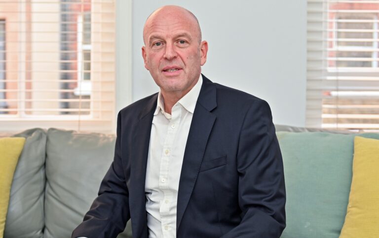 Business professional discussing the financial risks of delaying leasehold reform decisions