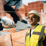 Construction worker laying bricks as London housebuilding faces criticism under Sadiq Khan’s policies
