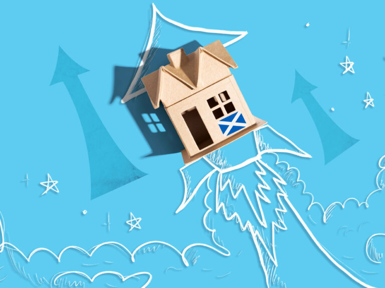 Cardboard house with Scottish flag lifting off like a rocket on blue background with arrows and clouds.