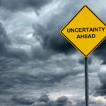 dark clouds and uncertainty ahead sign