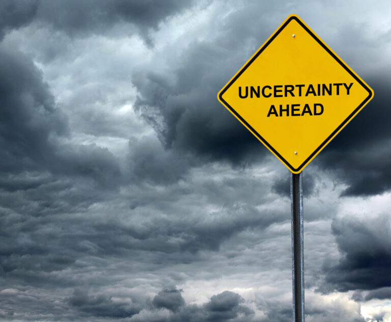 dark clouds and uncertainty ahead sign