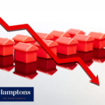 red small houses with red down arrow